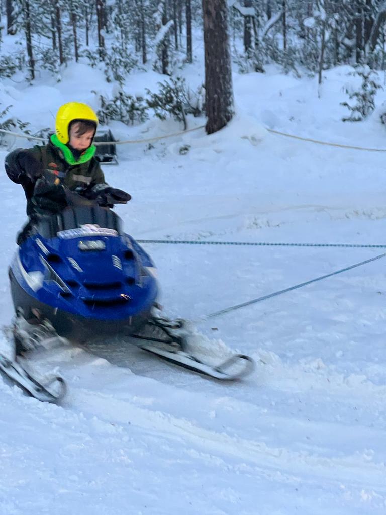boy riding mini skidoo