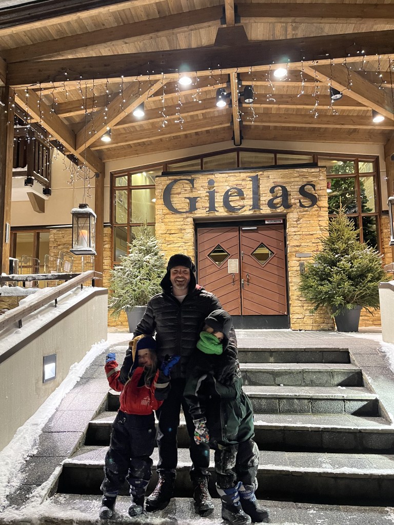 Family standing outside Giles wing at Hotel Tunturi Lapland