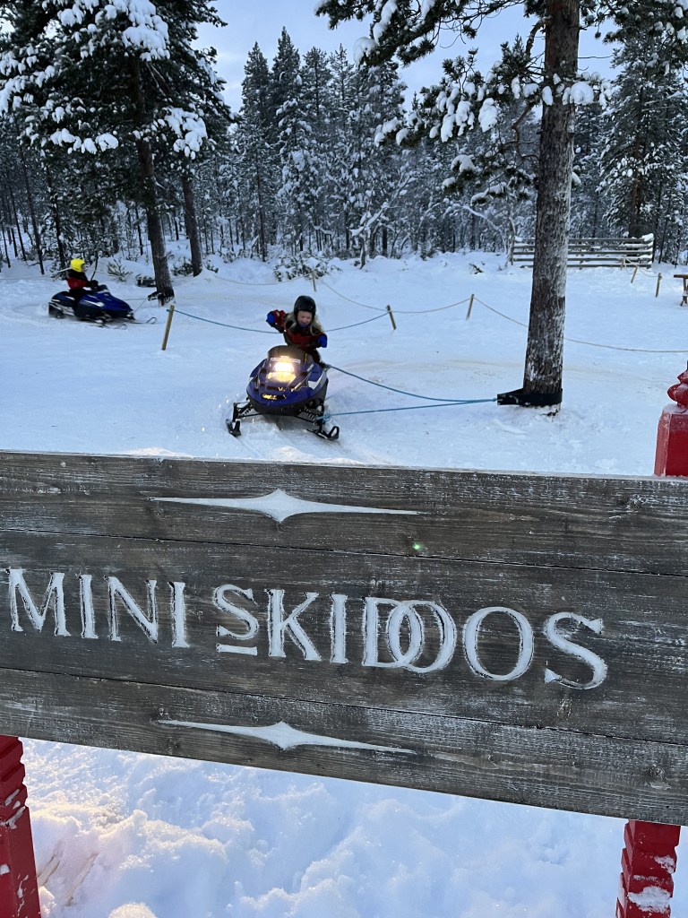 riding mini skidoos at Santa’s Lapland Santa’s Magic